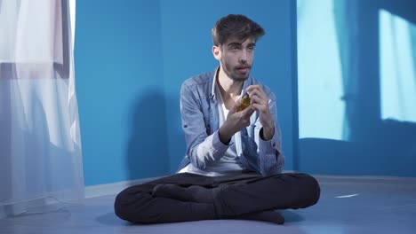 Suicide-man-leaning-against-the-wall.