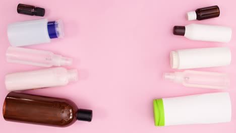 bottles with cosmetics products move on left nd right side. stop motion