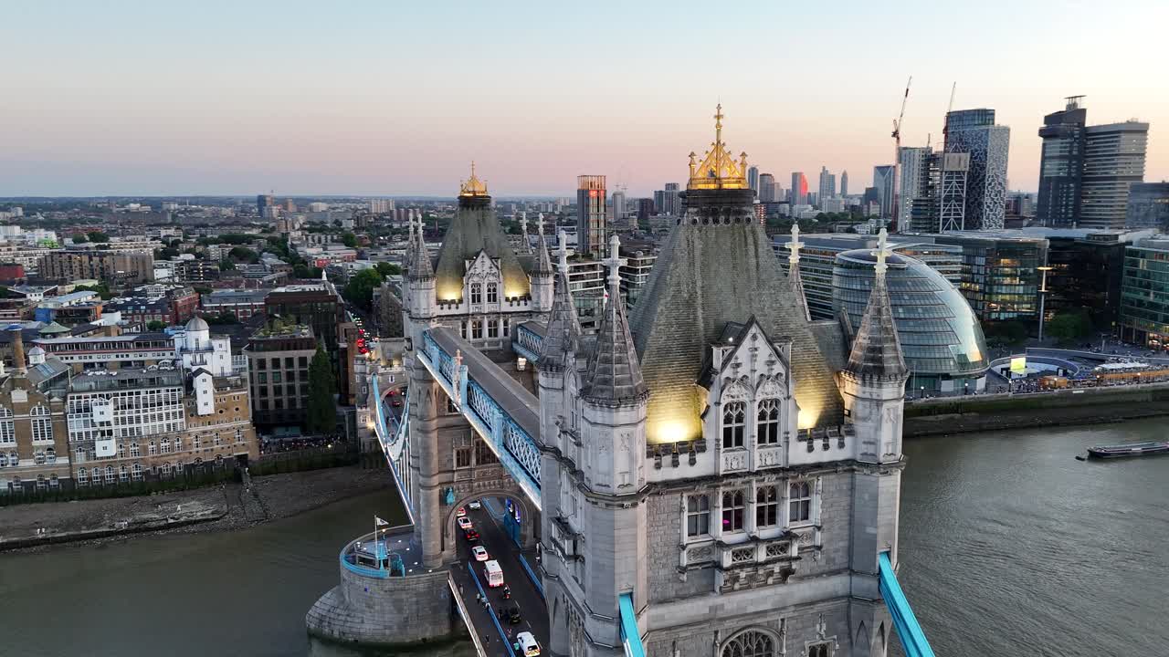 Aerial drone pan close-up of London’s Tower Bridge towers, revealing intricate stonework, Gothic details, and the timeless elegance of this world-famous landmark