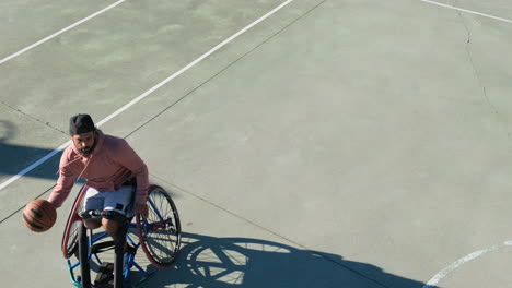 Energetic-middle-aged-man-riding-in-wheechair-at-court