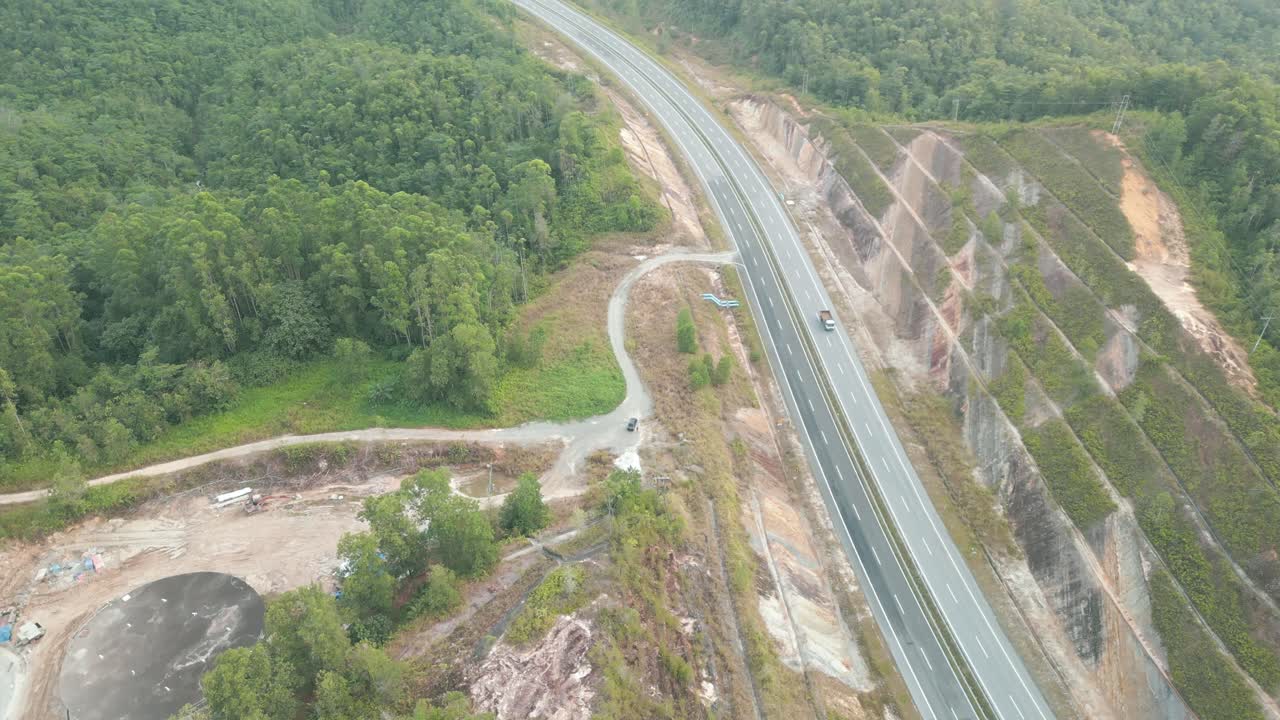 Beautiful Drone View Of Bau To Lundu Pan Borneo Highway During Morning Sunset With Mountain And Valley, Green Forest,Sarawak, Borneo.