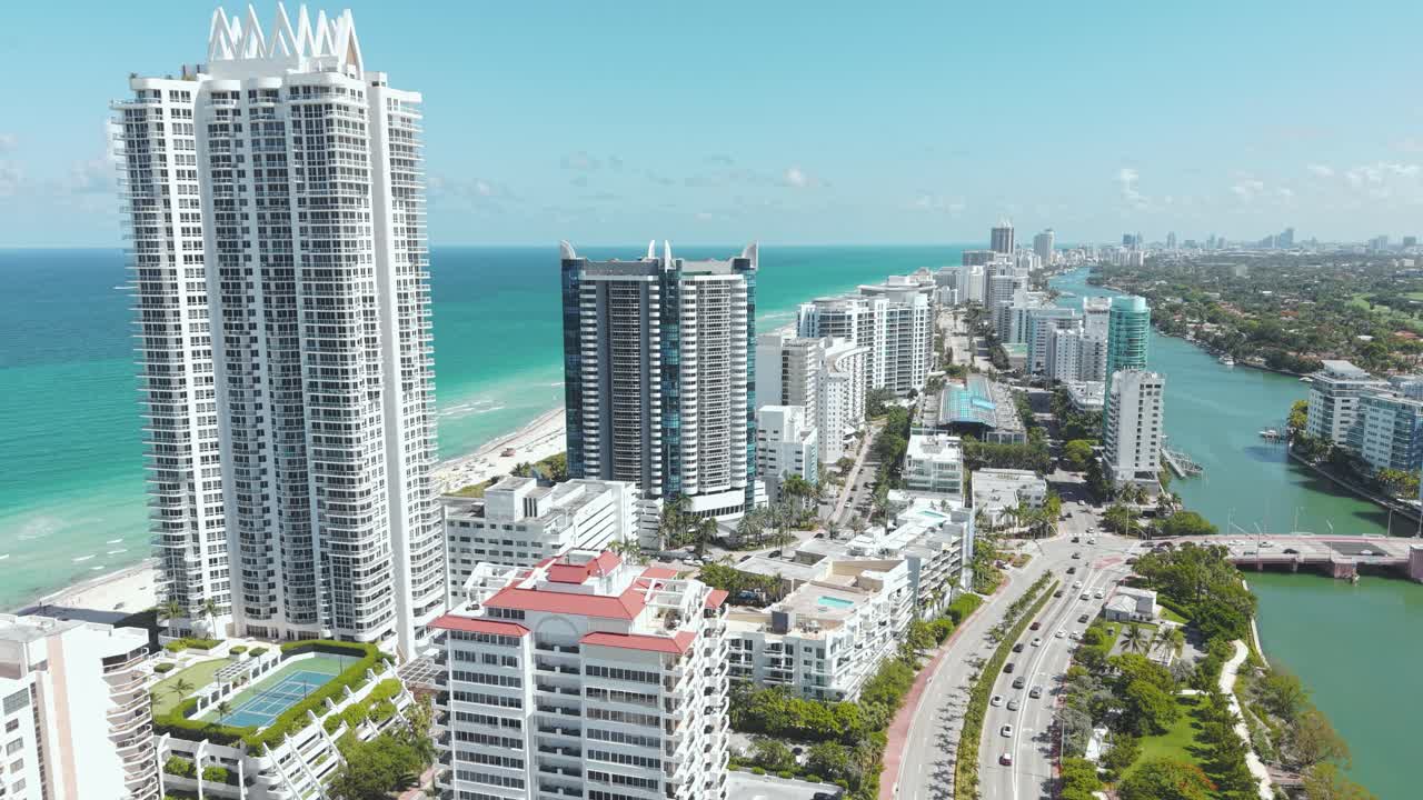 Aerial View of Miami Beach, Florida USA. Beachfront Condominium Towers and Traffic, Drone Shot