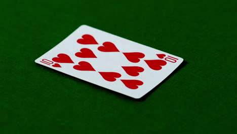 ten of hearts falling on casino table