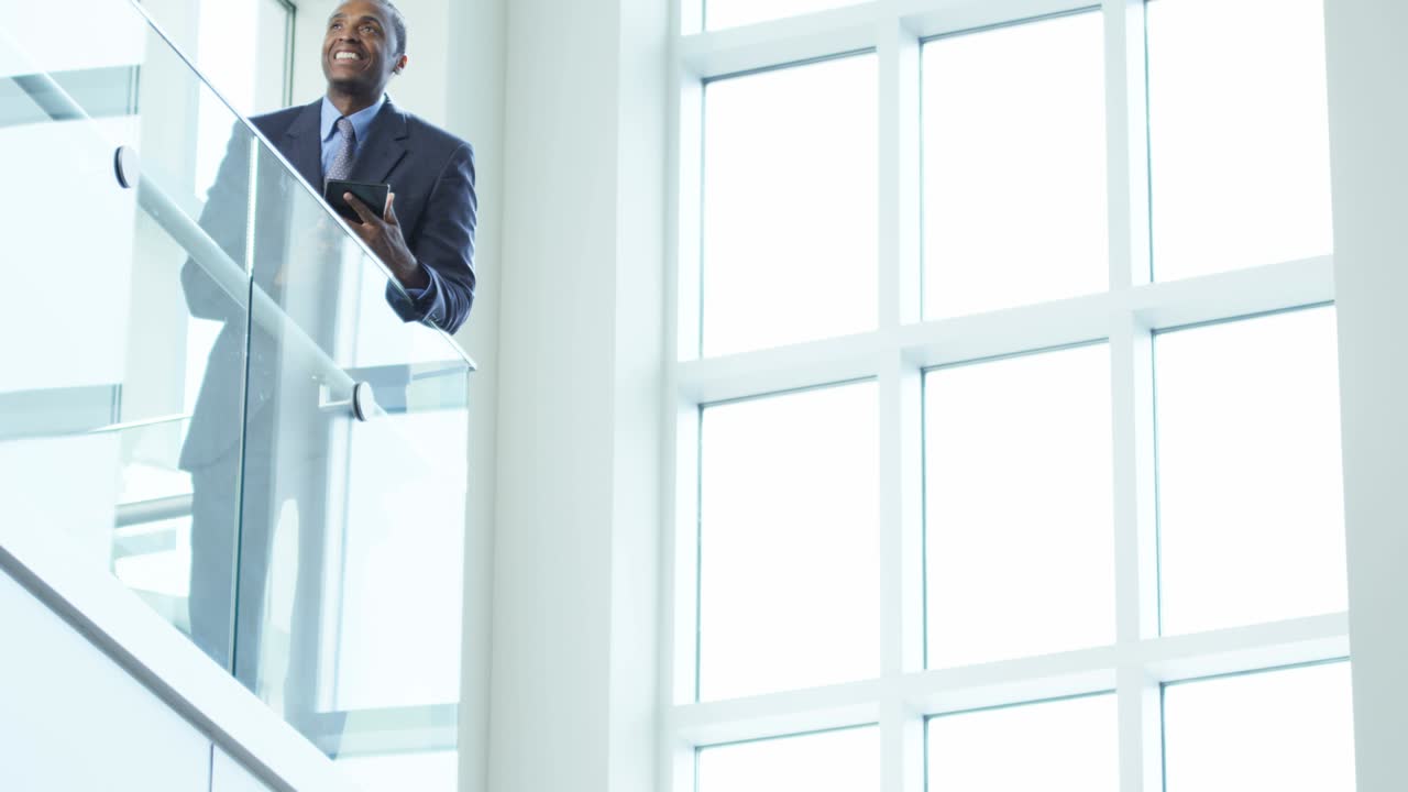 Male African American business manager using tablet technology