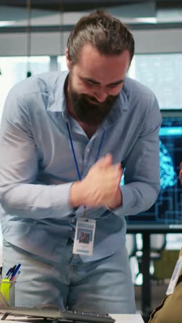 vertical video joyous colleagues having fun during break, concept of positive office culture
