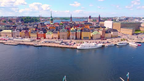 stunning aerial view of stockholm, sweden, river with parked cruise ships alongside beautiful architectural buildings, vibrant essence of city.