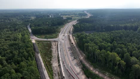 the drone shot shows a highway, with one section actively under construction