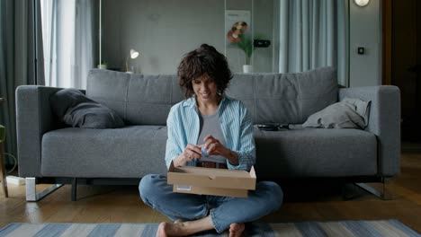 woman unboxing shoes at home