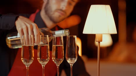 man pouring champagne