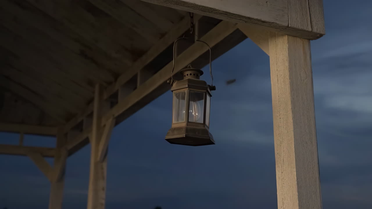 Vintage Lantern Hanging from a Wooden Porch at Dusk