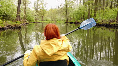 Outdoor-Girl-on-Travel-Tour-Paddle-with-Kajak-on-River-in-Spreewald