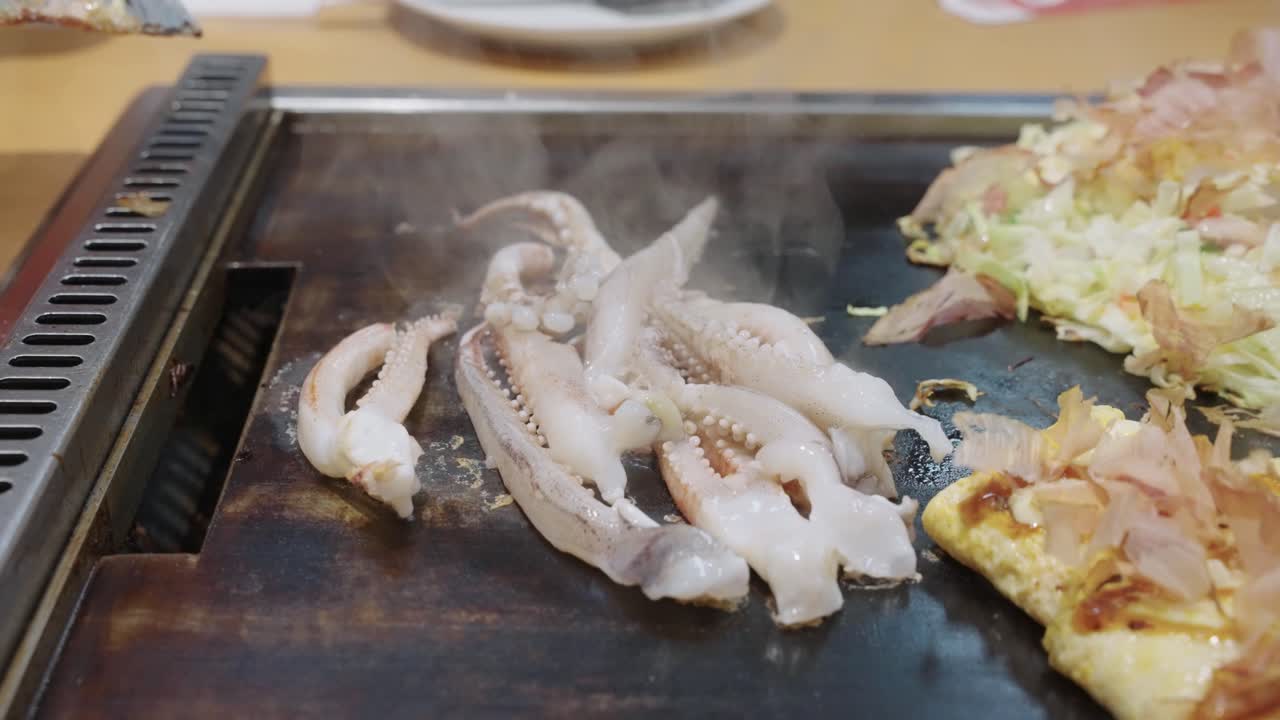 Grilled Squid Tentacles cooking in slow motion