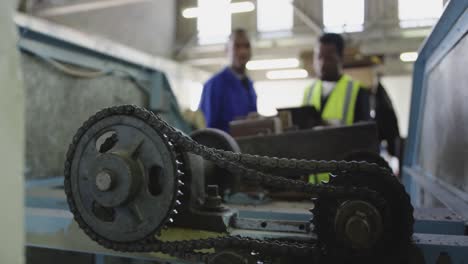 Mixed-race-man-working-in-factory