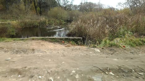 concrete waste pipes. streams of water flow through concrete pipes. polluted body of water in the park. shooting from the drone. aerial photography.