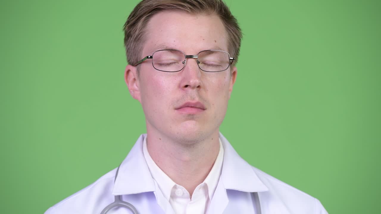 Young Man Doctor Relaxing With Eyes Closed