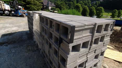 Walk-around-cubes-of-cinder-block-at-construction-site