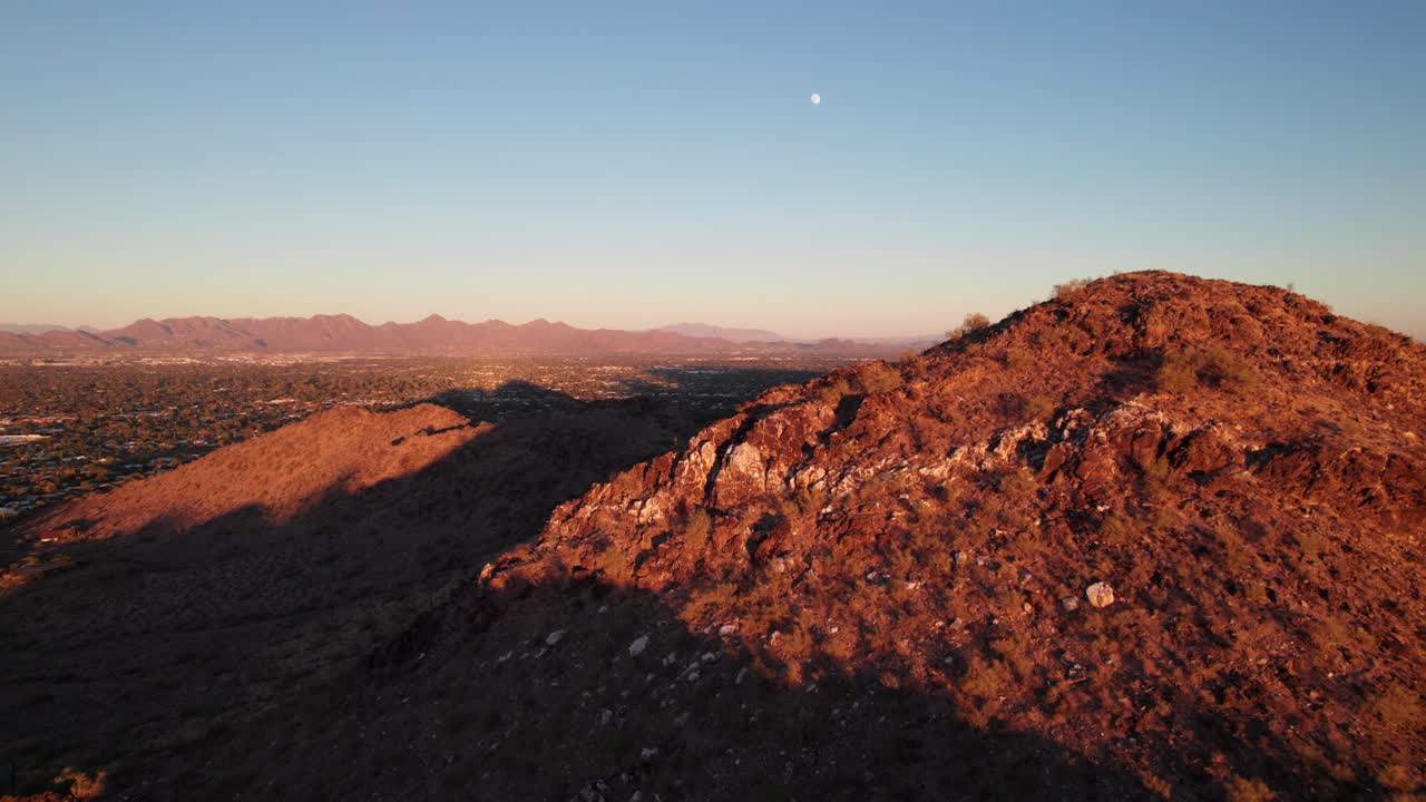 Landscape nature aerial of Arizona desert and mountains, rich warm colors and long smooth sunset shot.
