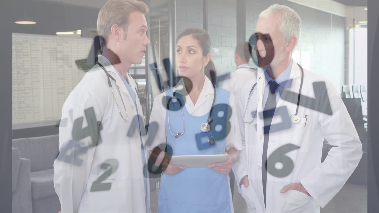 In hospital, medical professionals discussing patient data with animation of numbers