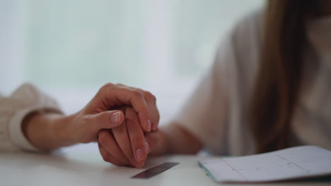 caring woman takes hand of beloved partner gently stroking