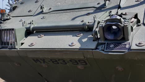 close up view of a smoke discharger system mounted on the side of an armored vehicle, enhancing its defensive capabilities