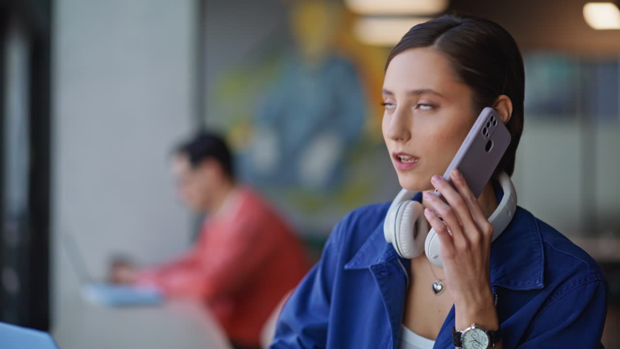 Business manager speaking smartphone in office coworking closeup. Woman calling