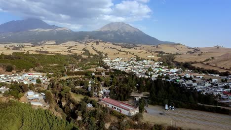 aerial: ex hacienda de san jacinto ixtoluca, view of the mountains and blue sky during the day in la mezquitera, morelos, mexico, pan drone shot