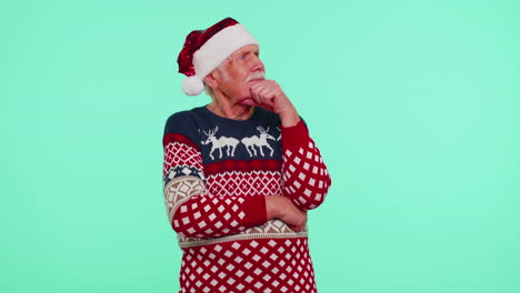 Grandfather-in-Christmas-sweater-make-gesture-raises-finger-came-up-with-creative-plan-good-idea