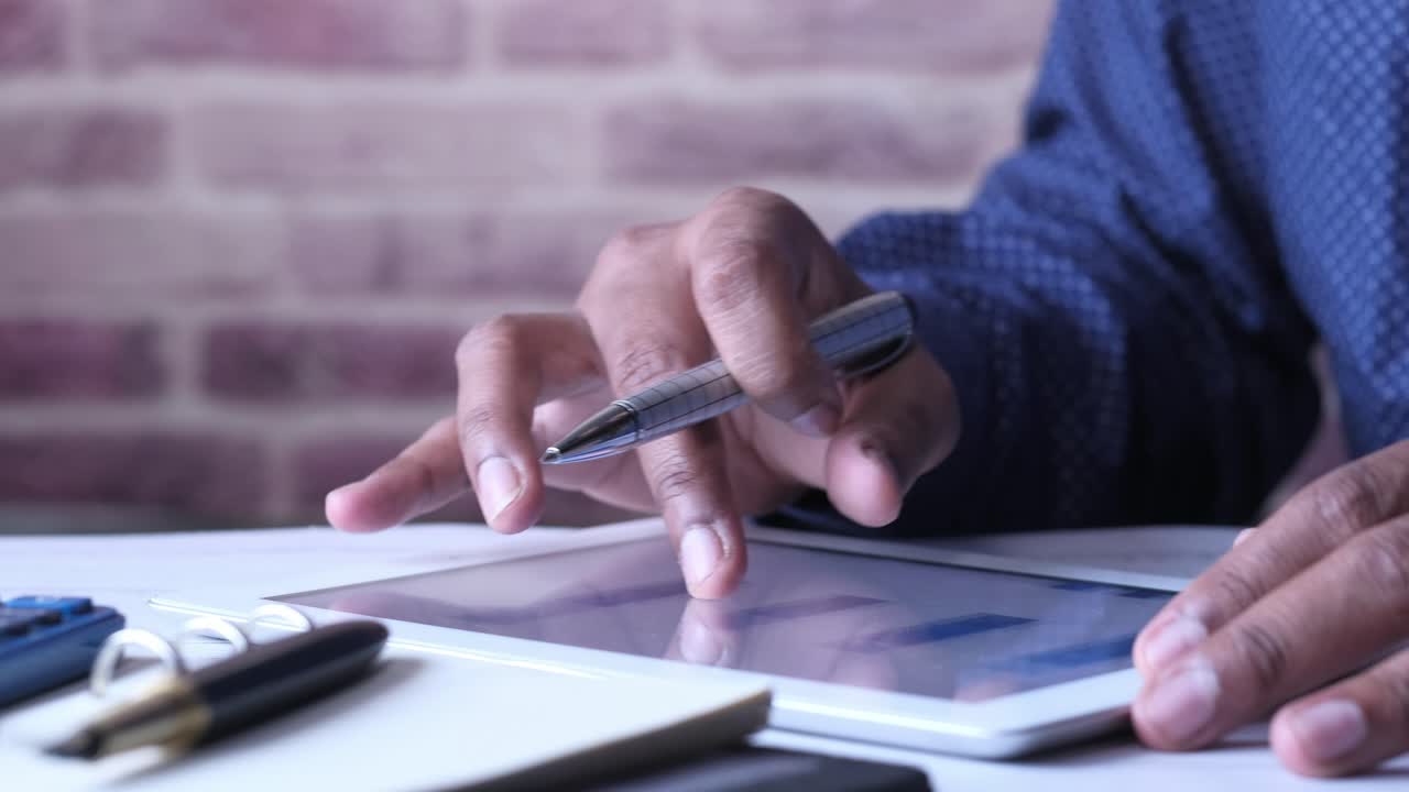 Businessman using tablet and pen