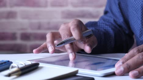 businessman using tablet and pen