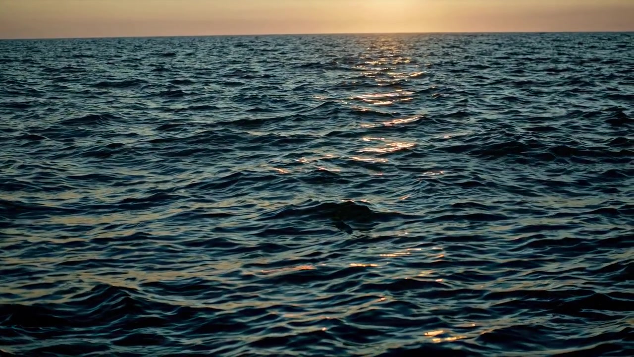 Golden Sunset Over Calm Ocean Waves
