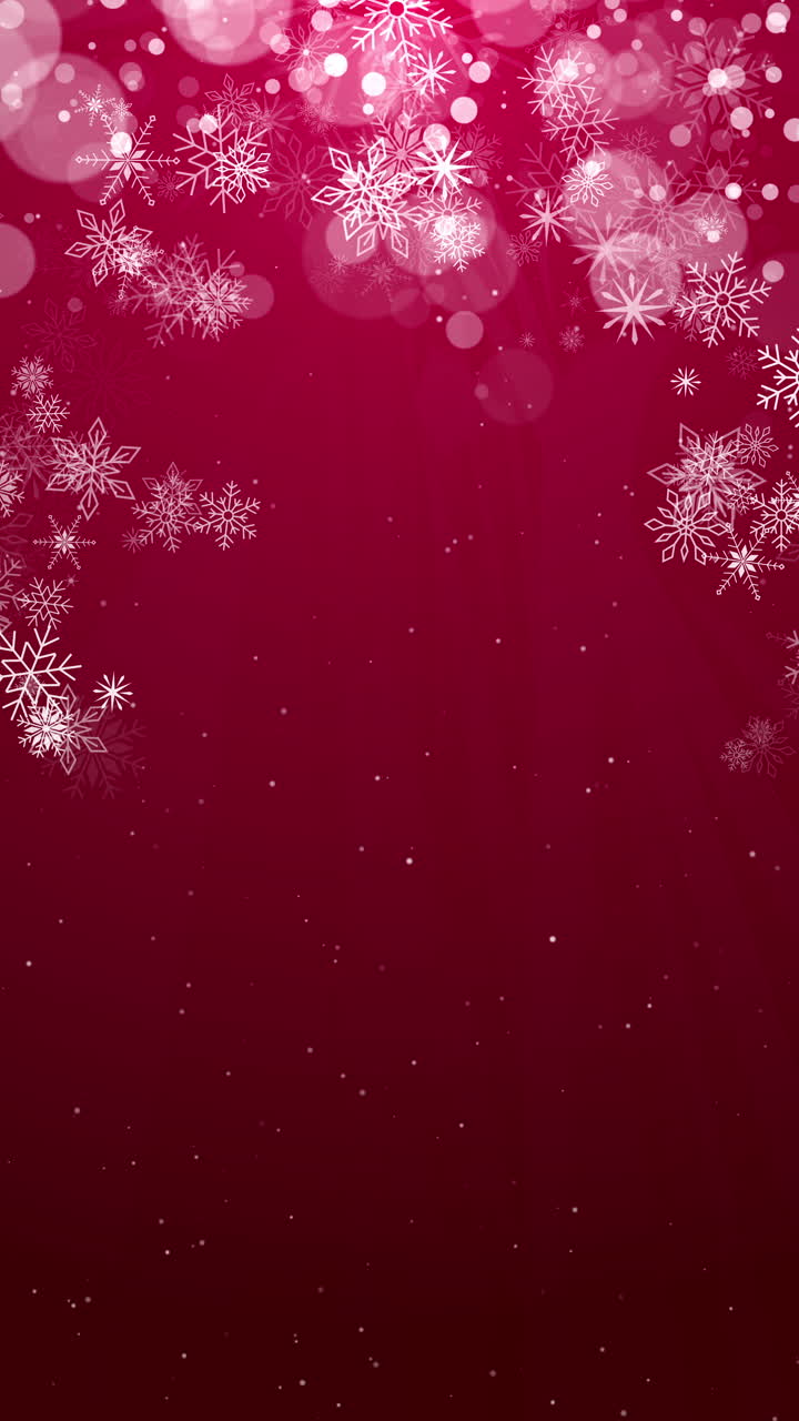 A lot of snowflakes falling from the sky. Abstract red background for holiday. Merry Christmas and Happy New Year loop animation. Vertical video.