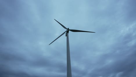 wind turbine against a cloudy sky
