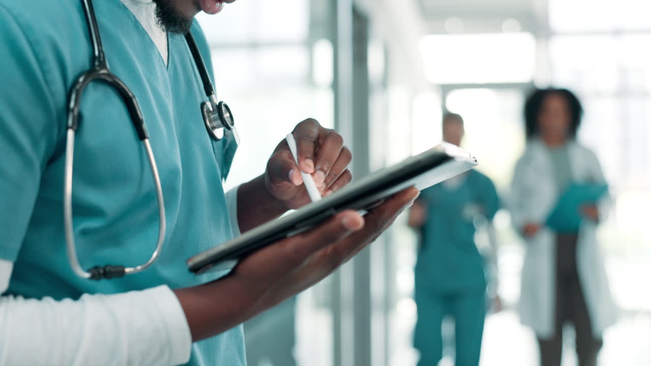 Medical professionals using technology in a hospital setting