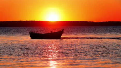 sunset boat on a calm lake