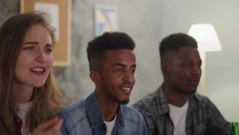 Black-guy-with-emotional-woman-and-friend-watches-baseball