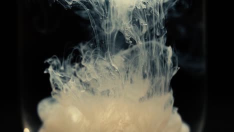 slowmotion shot showing paint floating in water. shot with the sony a7iii
