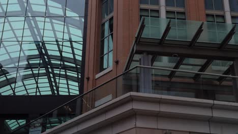 left to right pan of modern atrium ceiling and brick architecture
