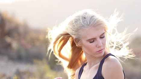 beautiful blonde female model enjoying stunning scenery while traveling