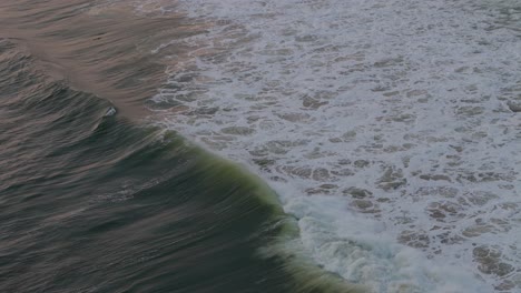 beach surfer wave in slow motion during sunset in lagos nigeria