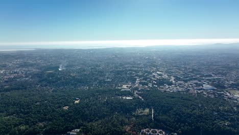 high altitude shot of montpellier mediterranean sea backdrop and lush vegetation