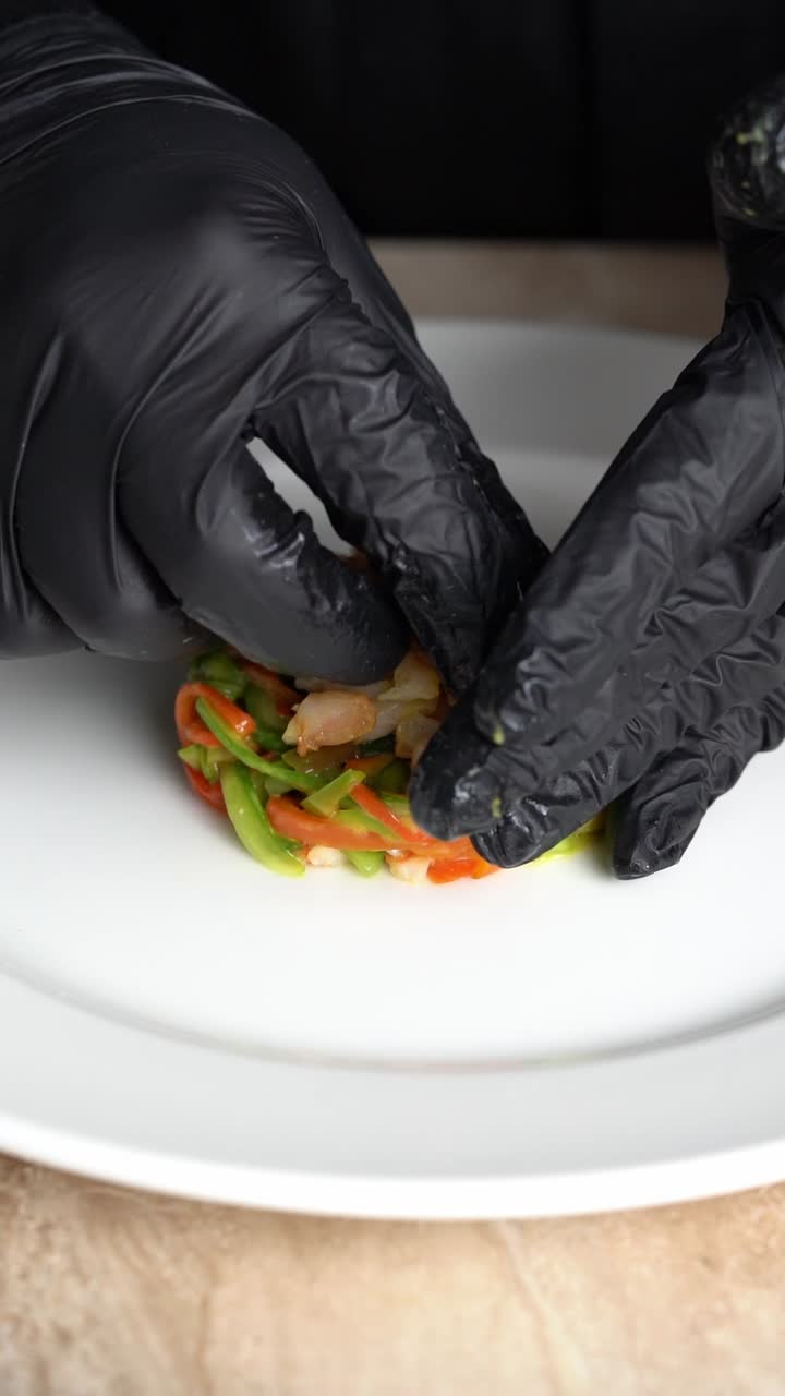 Professional Chef Plating a Colorful Shrimp and Vegetable Salad