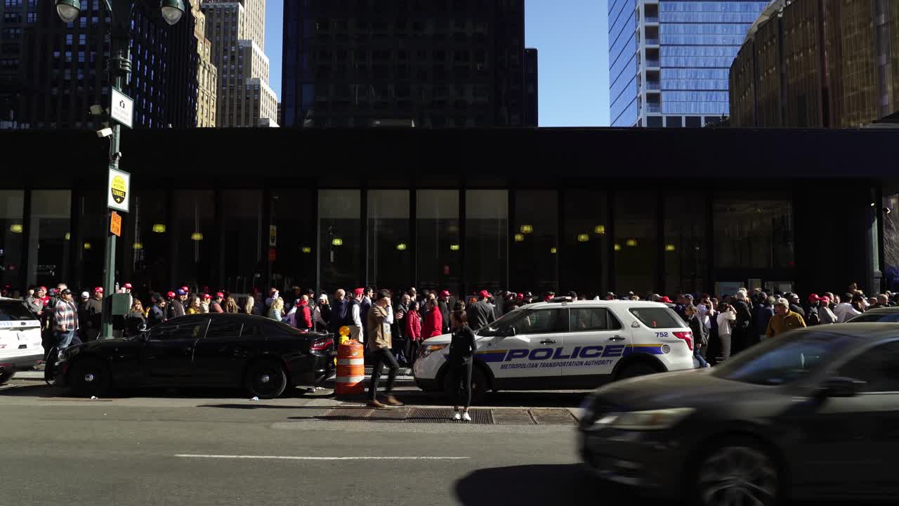 Large Crowd of People Waiting in Line on a City Street in New York City