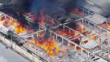 massive factory fire: aerial view of devastating blaze