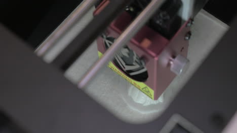 top close-up view of mechanism of 3d printer in process