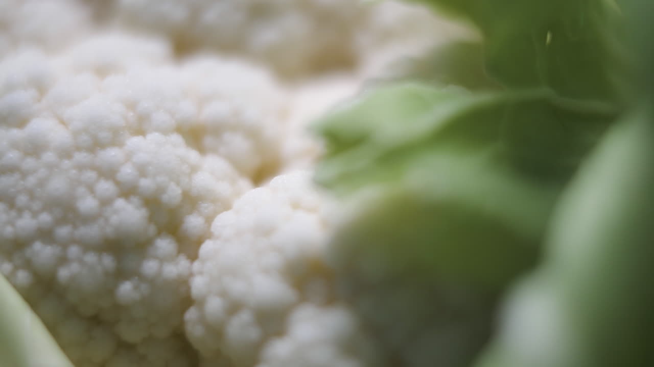Slow slider shot of fresh raw organic cauliflower health food natural vegetation macro close focus