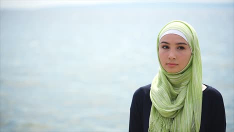 young woman wearing hijab outdoors