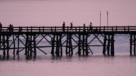 The-Mon-Bridge-is-an-old-wooden-bridge-located-in-Sangkla,-Thailand