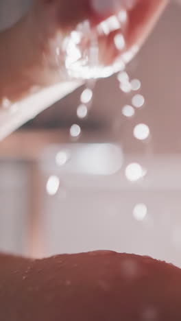 lady carefully takes soothing shower washing hair. warm water cascades down skin of woman. young lady takes shower cleansing skin with hot water