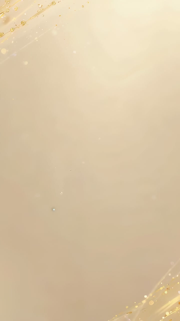 Video verticale: la telecamera esegue una panoramica su una superficie lucida beige al chiuso, catturando striature e goccioline