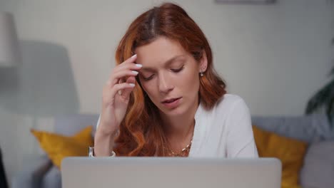 Thoughtful female make difficult decision lost in thought reflecting with laptop